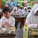 Over 1,000 children fall ill from free school lunches in Indonesia